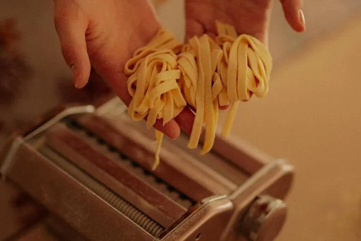 Fresh pasta coming out of a pasta machine